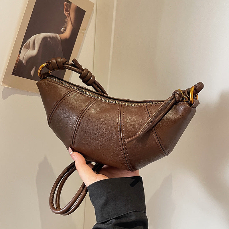 Brown crossbody horn bag