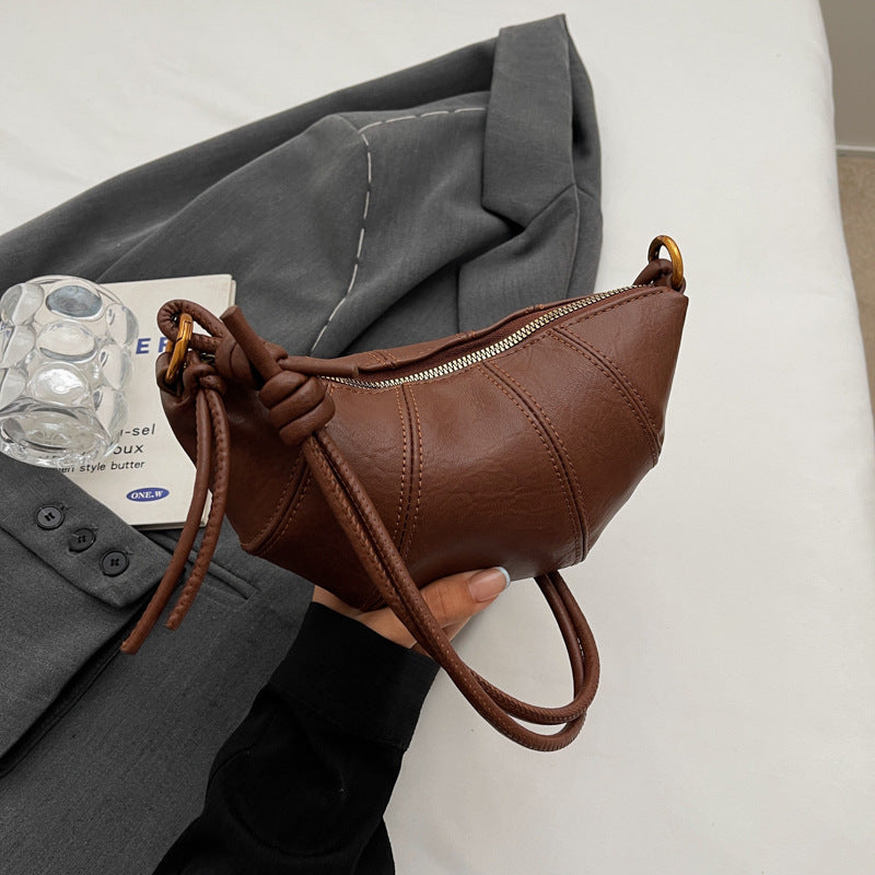 Brown crossbody horn bag