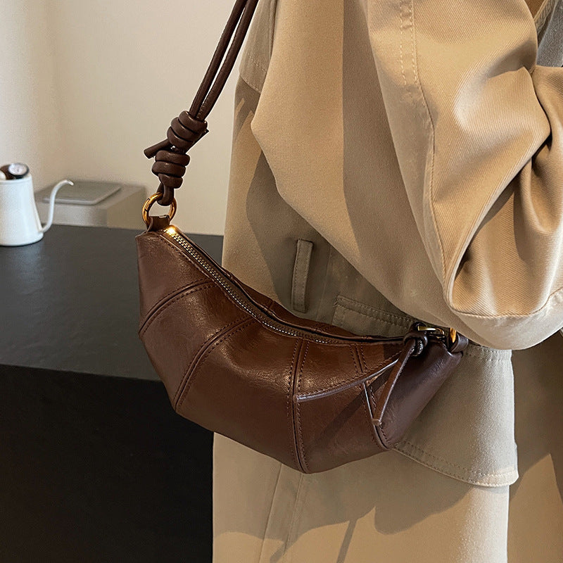 Brown crossbody horn bag