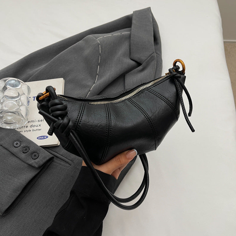 Brown crossbody horn bag